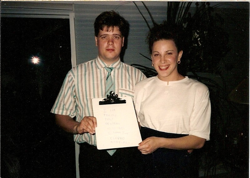 Claudia and Thomas holding a message Jessica wrote