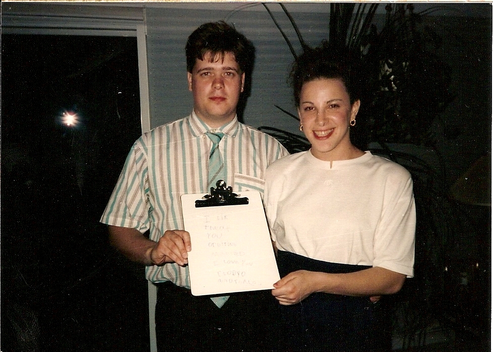 Claudia and Thomas holding a message Jessica wrote
