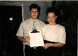 Claudia and Thomas holding a message Jessica wrote