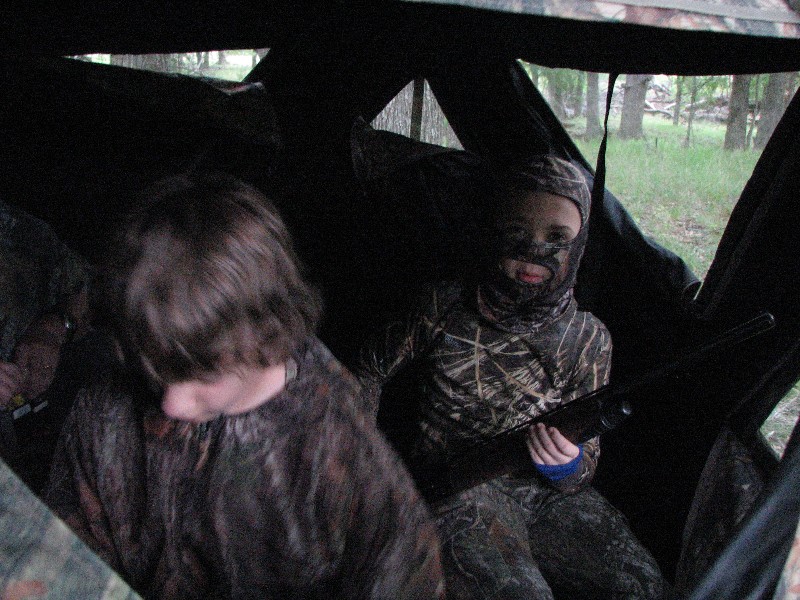 David with a shotgun and Jacob with a bow, hunting Turkey on a very cold and icy day