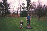 Mowing the lawn with daddy. The picture is from German Town Wisconsin Mowing the lawn with daddy. The picture is from German Town Wisconsin