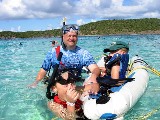 After the snuba diving. Brother David has been breathing the whole time from the tank while sitting in the rubber boat After the snuba diving. Brother David has been breathing the whole time from the tank while sitting in the rubber boat