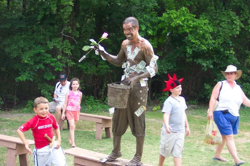 David gave the mud wrestler a dollar, he also got flowers from somebody