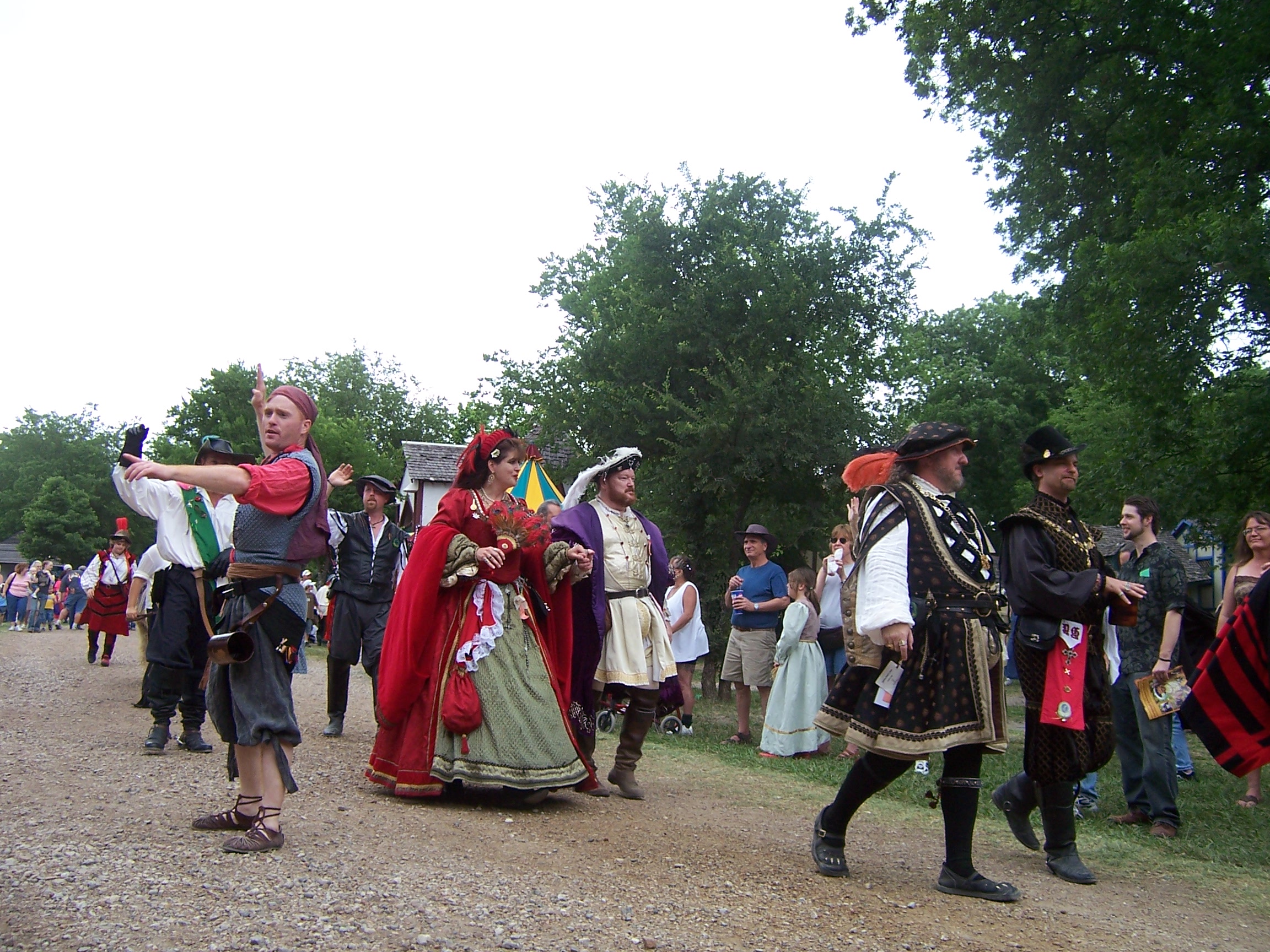 The King is in purple the Queen in Red. Every day they have a parade at Scarborough Faire. There are several hundred participants including the King and the Queen