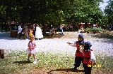 Jacob and David sword fighting while Sara VanNewkirk is ignoring them Jacob and David sword fighting while Sara VanNewkirk is ignoring them
