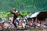 The mud wrestling show, one of the funniest shows at Scarborough Faire. It occurs in the evil mud pit The mud wrestling show, one of the funniest shows at Scarborough Faire. It occurs in the evil mud pit