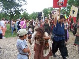 A paradee is touching Jacksons face. Every day they have a parade at Scarborough Faire. There are several hundred participants including the King and the Queen A paradee is touching Jacksons face. Every day they have a parade at Scarborough Faire. There are several hundred participants including the King and the Queen