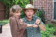 Critter man with a milk snake. Critter man came for my fifth birtday. He was showing Texas critters. The milk snake is harmless, but it looks like the Texas Coral Snake which can kill ten adults. To know the difference. Red touches Yellow you are a dead fellow, Red touches black you are Okey Jack.