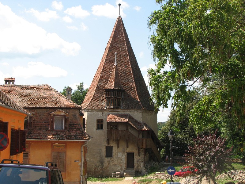 The city was surrounded by a wall with nine towers.