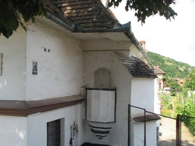 The priest crawled under the leper colony through a tunnel to reach the Church. This was the Priest never needed to get close to the Lepers.
