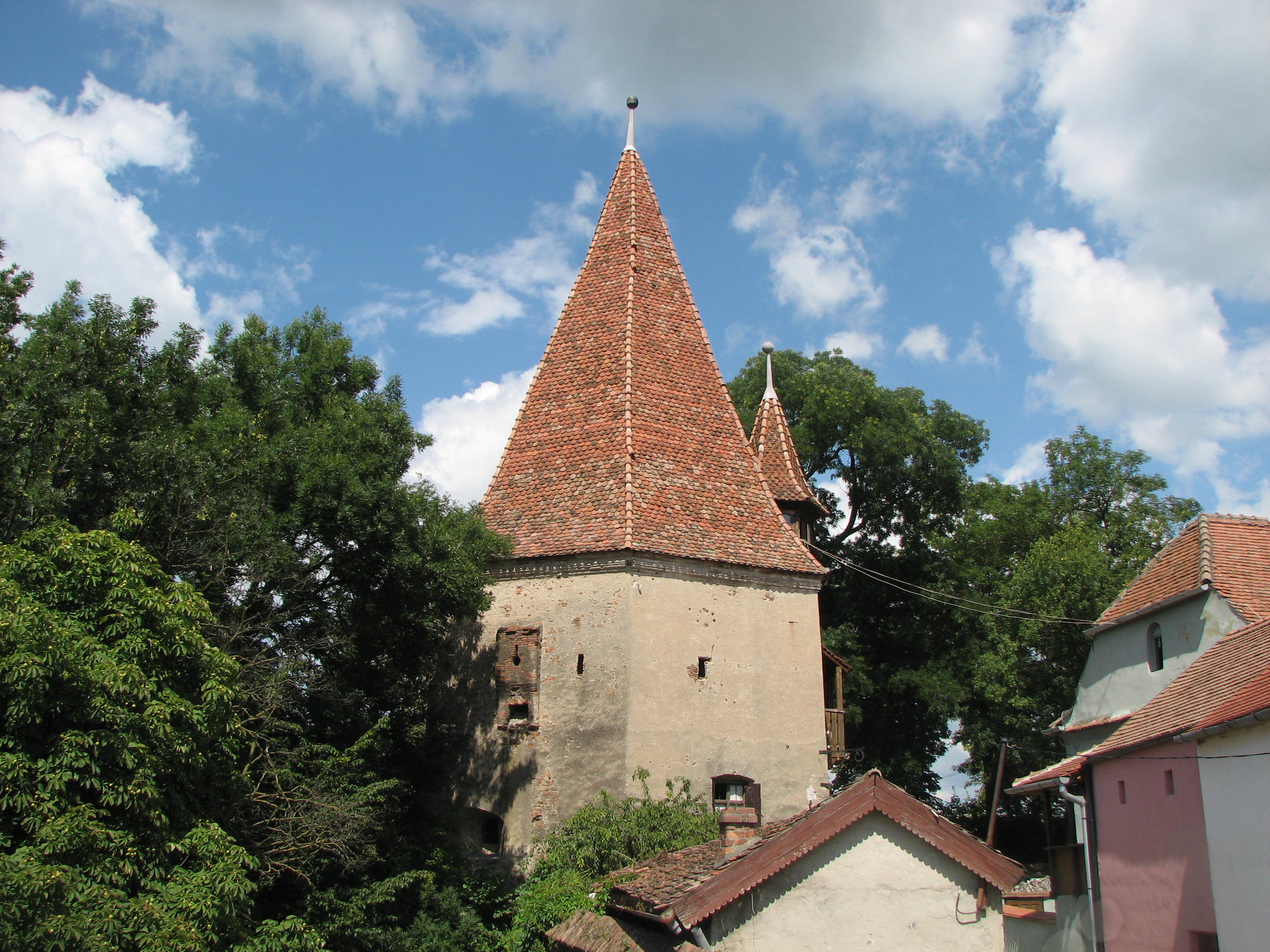 The city was surrounded by a wall with nine towers.