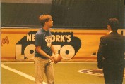 Thomas throwing a football at intermission, Madison Square Garden