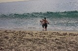 The boys tried to surf the waves at Laguna Beach