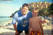 Thomas and Jacob on the Beach, the hotel in the background