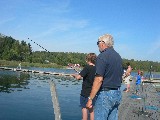 Jacob is fishing for rainbow trout. Grandpa Stig is watching