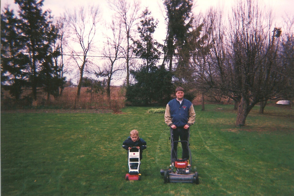 Mowing the lawn with daddy. The picture is from German Town Wisconsin